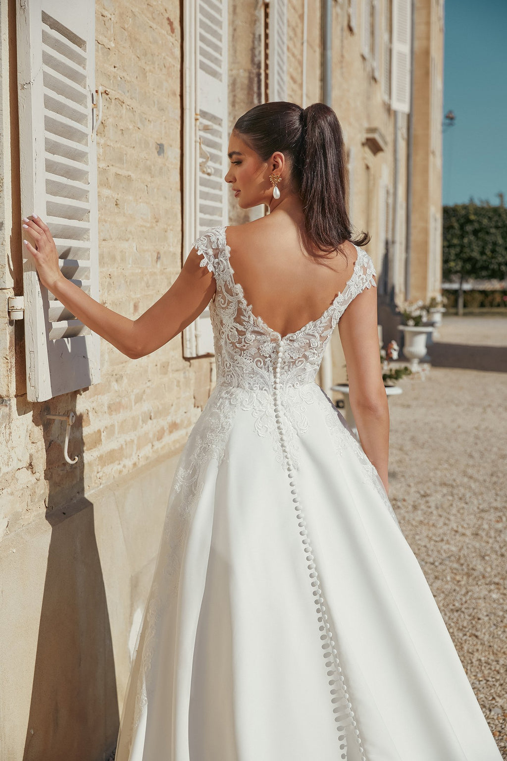 Satin A-Line Bridal Gown with Modest V-Neckline and Cap Sleeves